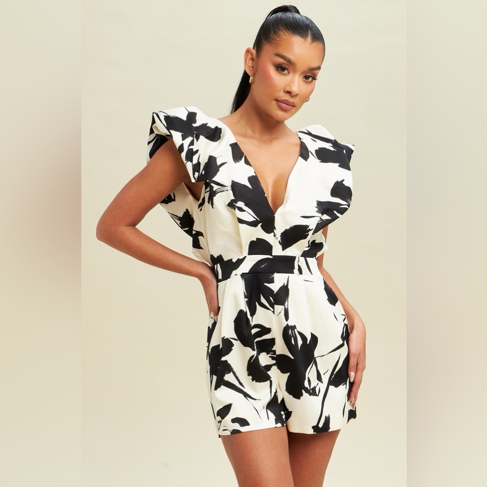 463. Ivory and Black Oversized Shoulders Romper